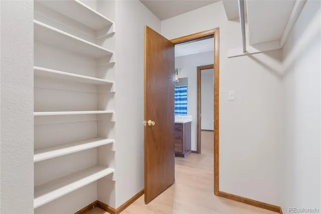 a view of a lush green hillside and houses