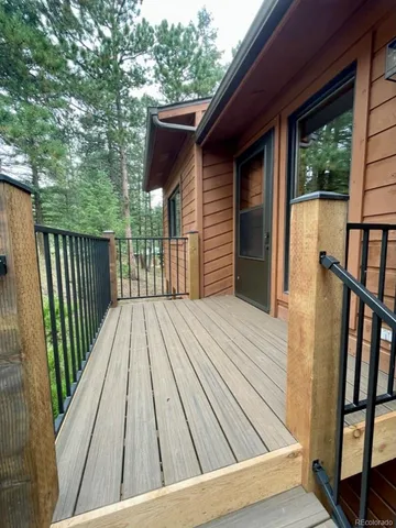 a living room with furniture fireplace and a large window