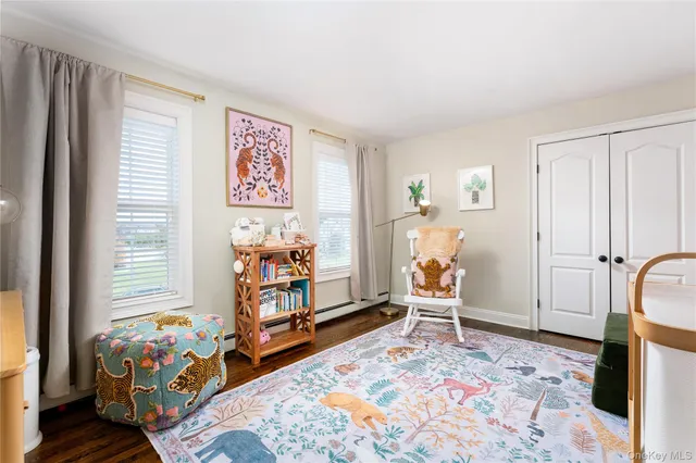 a bedroom with furniture and a window