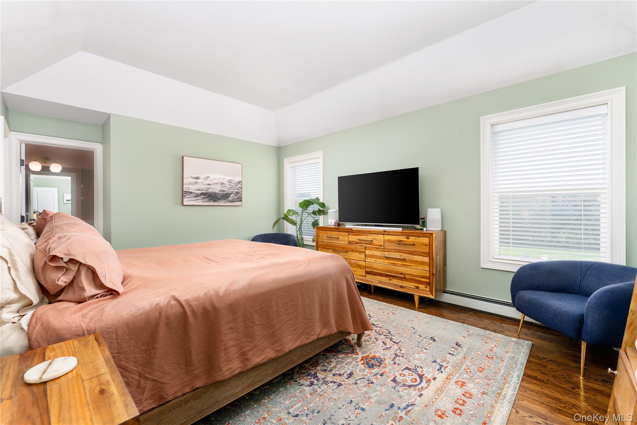 108 Calverton Court Wading River, NY 11792 - Photo 20 of 36 a bedroom with a bed and a flat screen tv