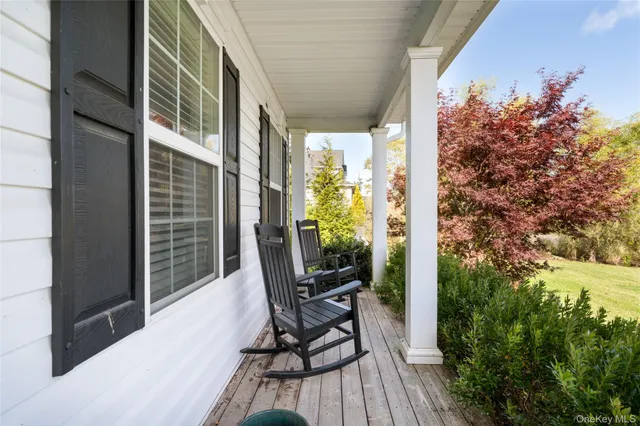 a view of balcony with chair and wooden floor