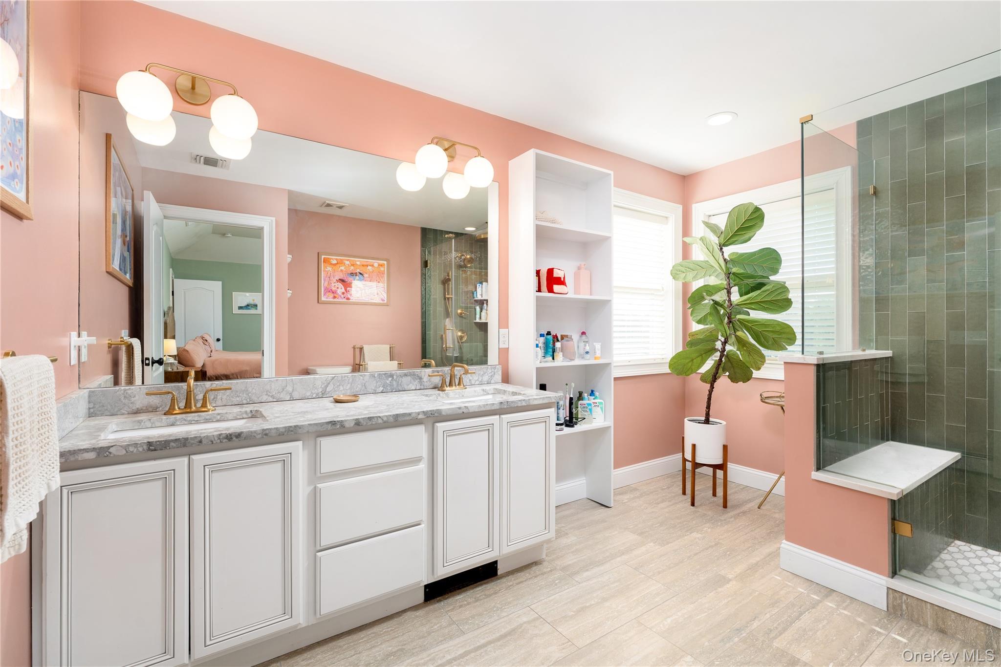 108 Calverton Court Wading River, NY 11792 - Photo 22 of 36 a bathroom with a double vanity sink and a mirror