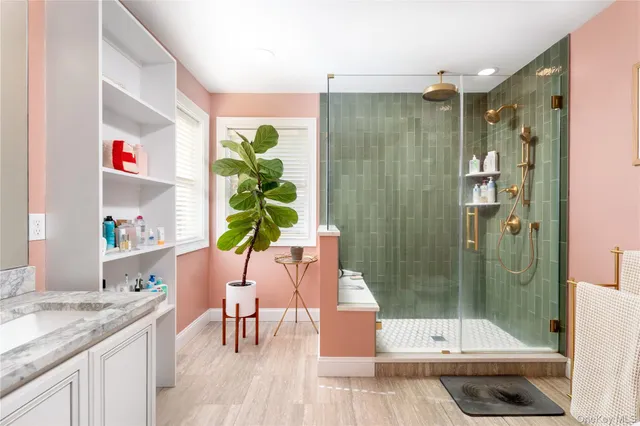 a bathroom with a shower and a sink