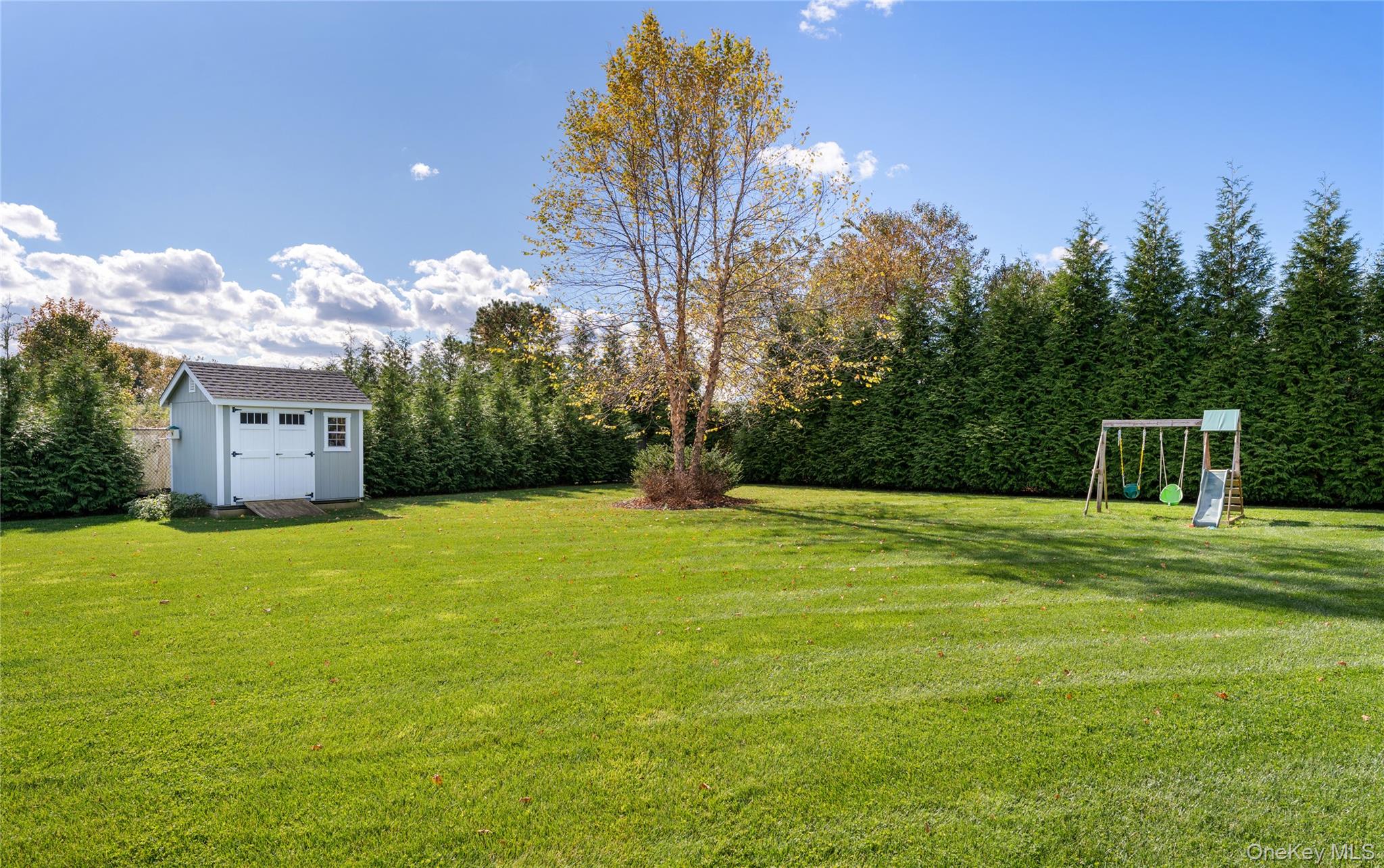 108 Calverton Court Wading River, NY 11792 - Photo 32 of 36 a house view with a garden space