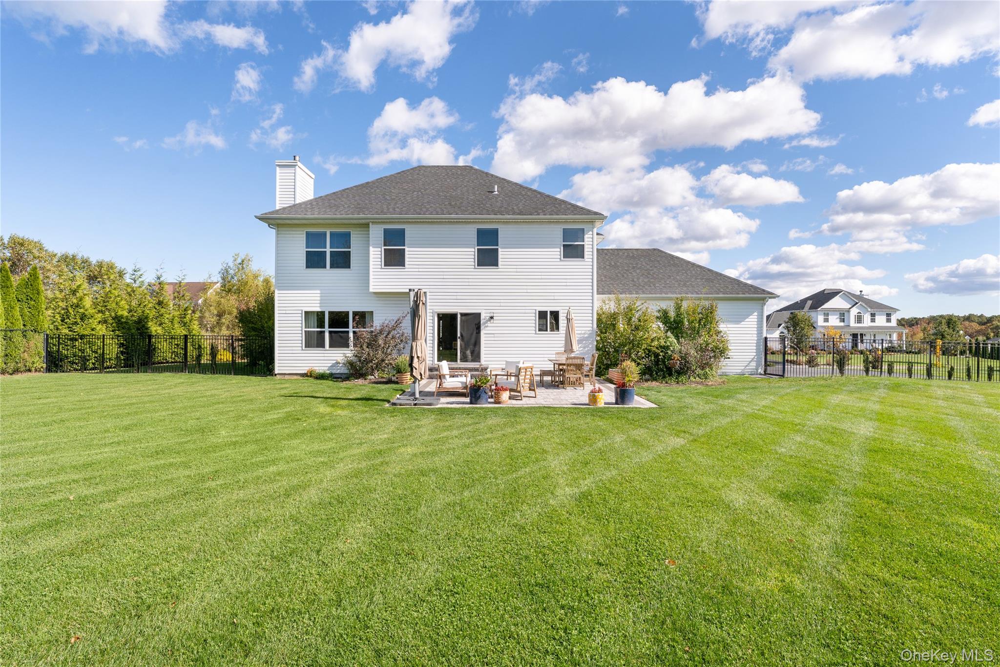108 Calverton Court Wading River, NY 11792 - Photo 34 of 36 a view of a house with a yard