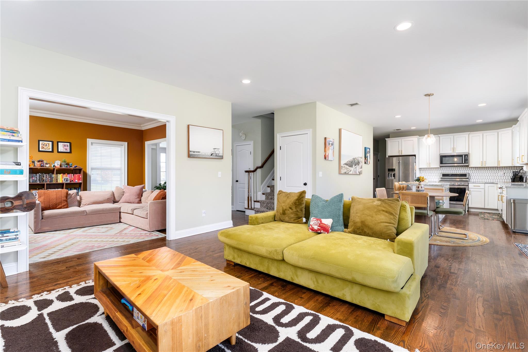 108 Calverton Court Wading River, NY 11792 - Photo 6 of 36 a living room with furniture and a large window