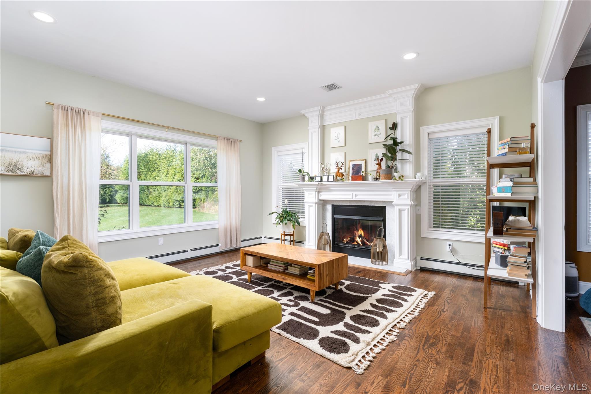 108 Calverton Court Wading River, NY 11792 - Photo 7 of 36 a bedroom with furniture and a fireplace