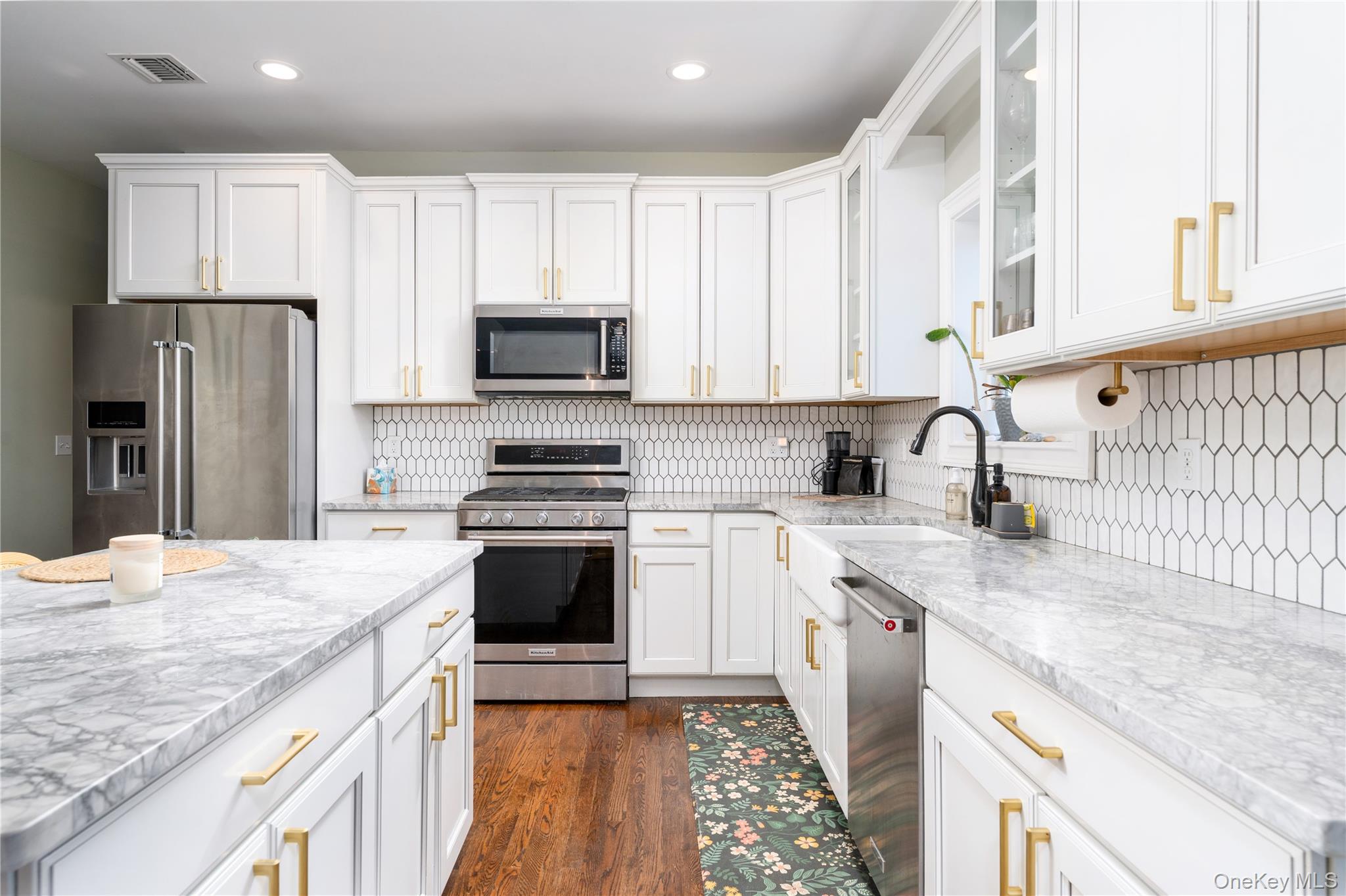 108 Calverton Court Wading River, NY 11792 - Photo 9 of 36 a kitchen with granite countertop a refrigerator stove and sink