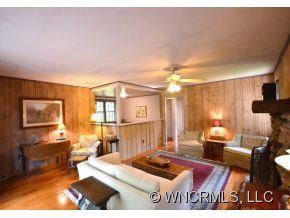 231 Woodland Road Tryon, NC 28782 - Photo 11 of 24 a living room with furniture and a table