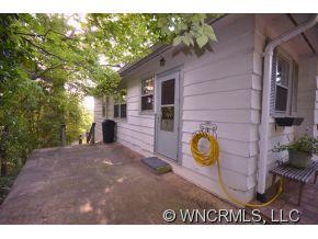 231 Woodland Road Tryon, NC 28782 - Photo 3 of 24 a view of outdoor space and dinning table