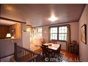 231 Woodland Road Tryon, NC 28782 - Photo 9 of 24 a view of a dining room with furniture window and outside view