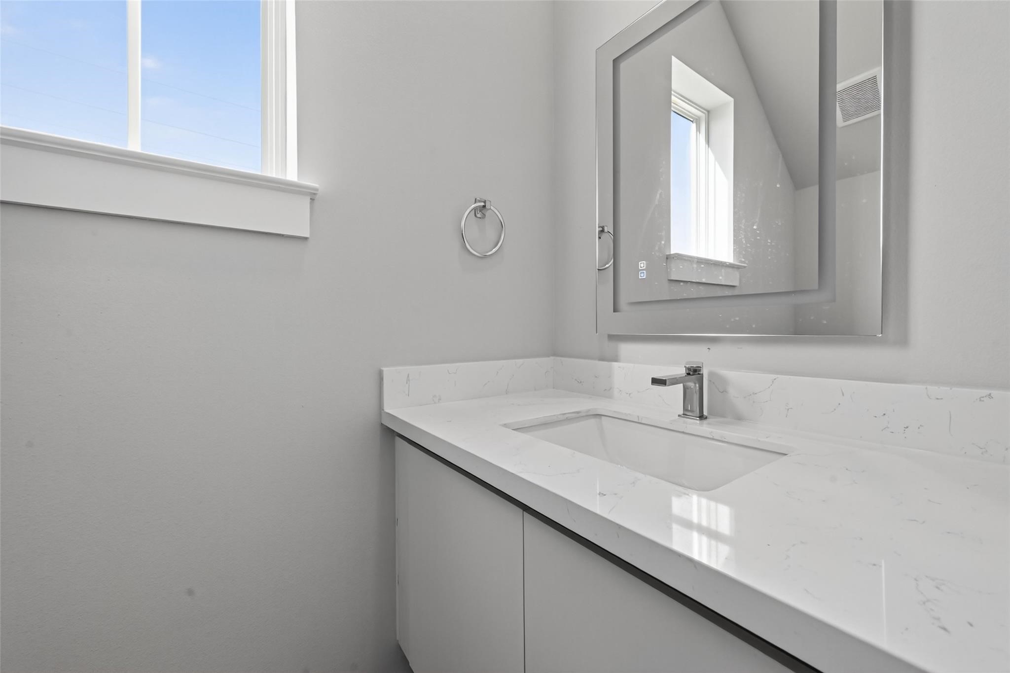 6702 Metro Boulevard, Unit 8 Houston, TX 77083 - Photo 14 of 36 a bathroom with a sink and a vanity
