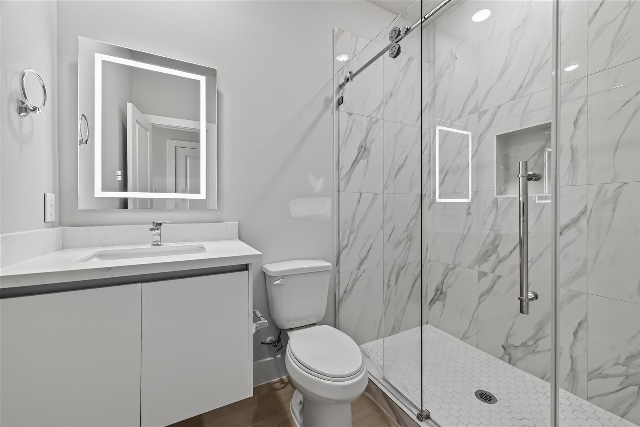 6702 Metro Boulevard, Unit 8 Houston, TX 77083 - Photo 23 of 36 a bathroom with a sink toilet and shower