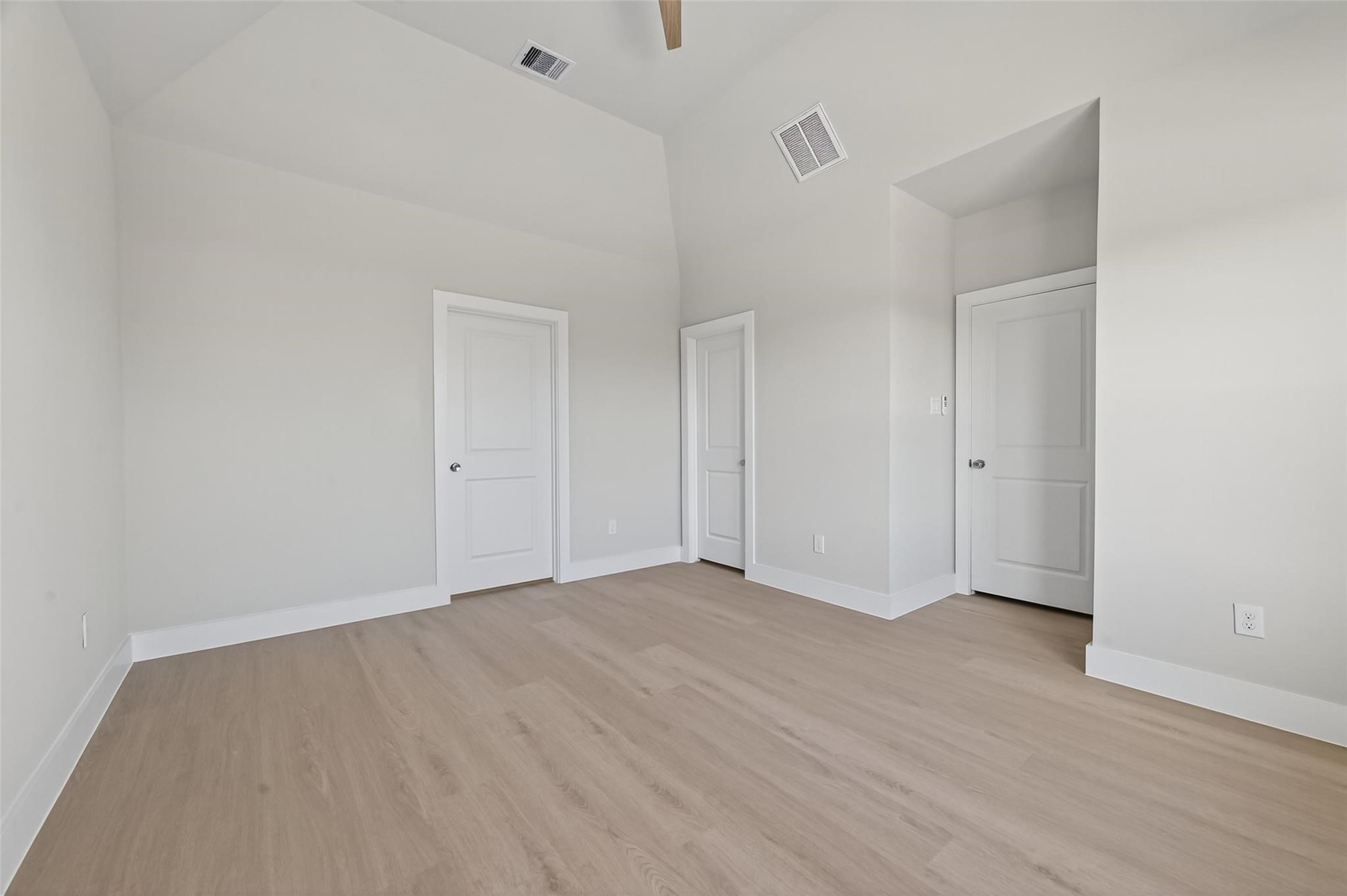 6702 Metro Boulevard, Unit 8 Houston, TX 77083 - Photo 25 of 36 a view of an empty room with wooden floor