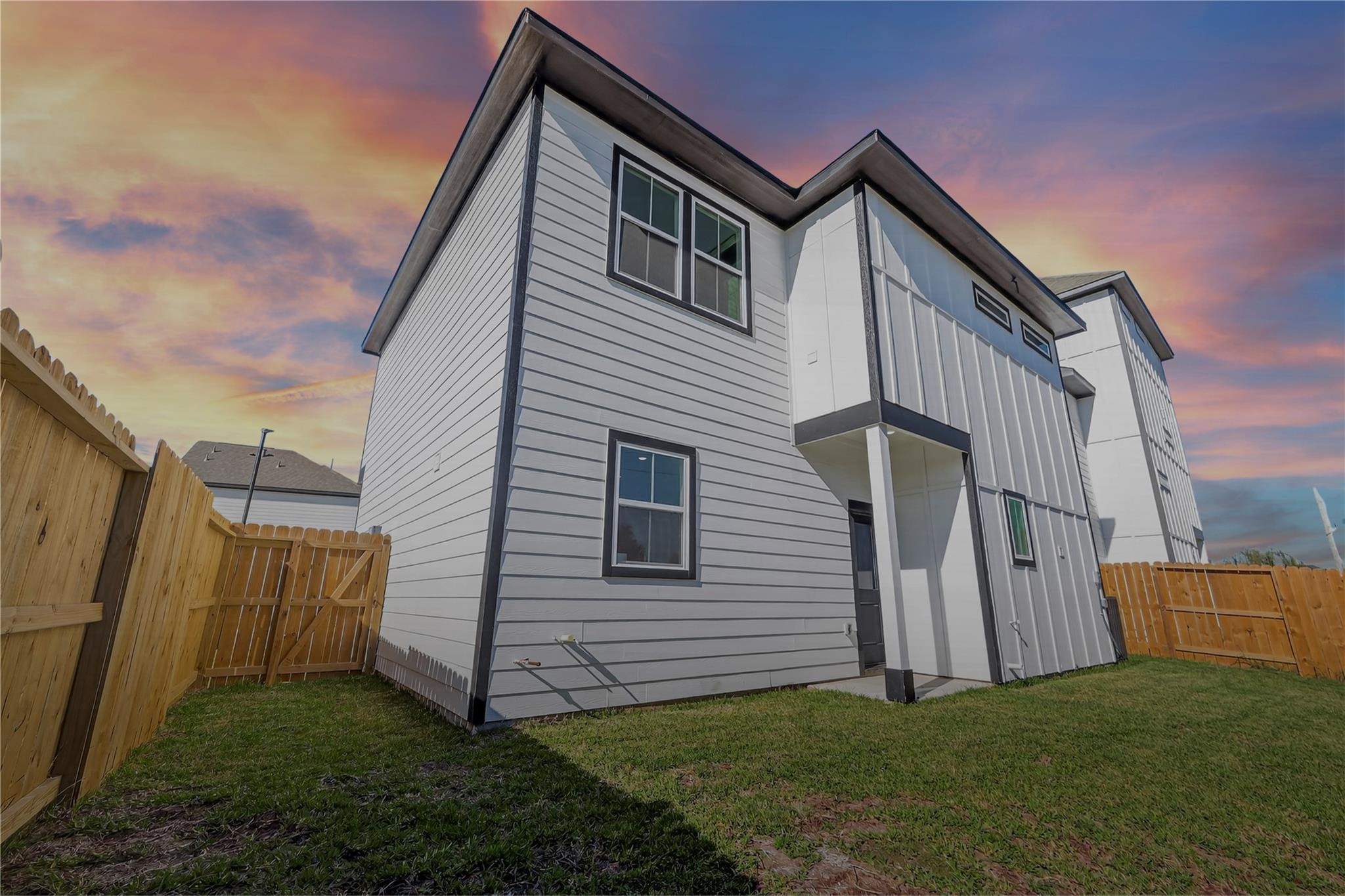 6702 Metro Boulevard, Unit 8 Houston, TX 77083 - Photo 27 of 36 a view of a house with a yard