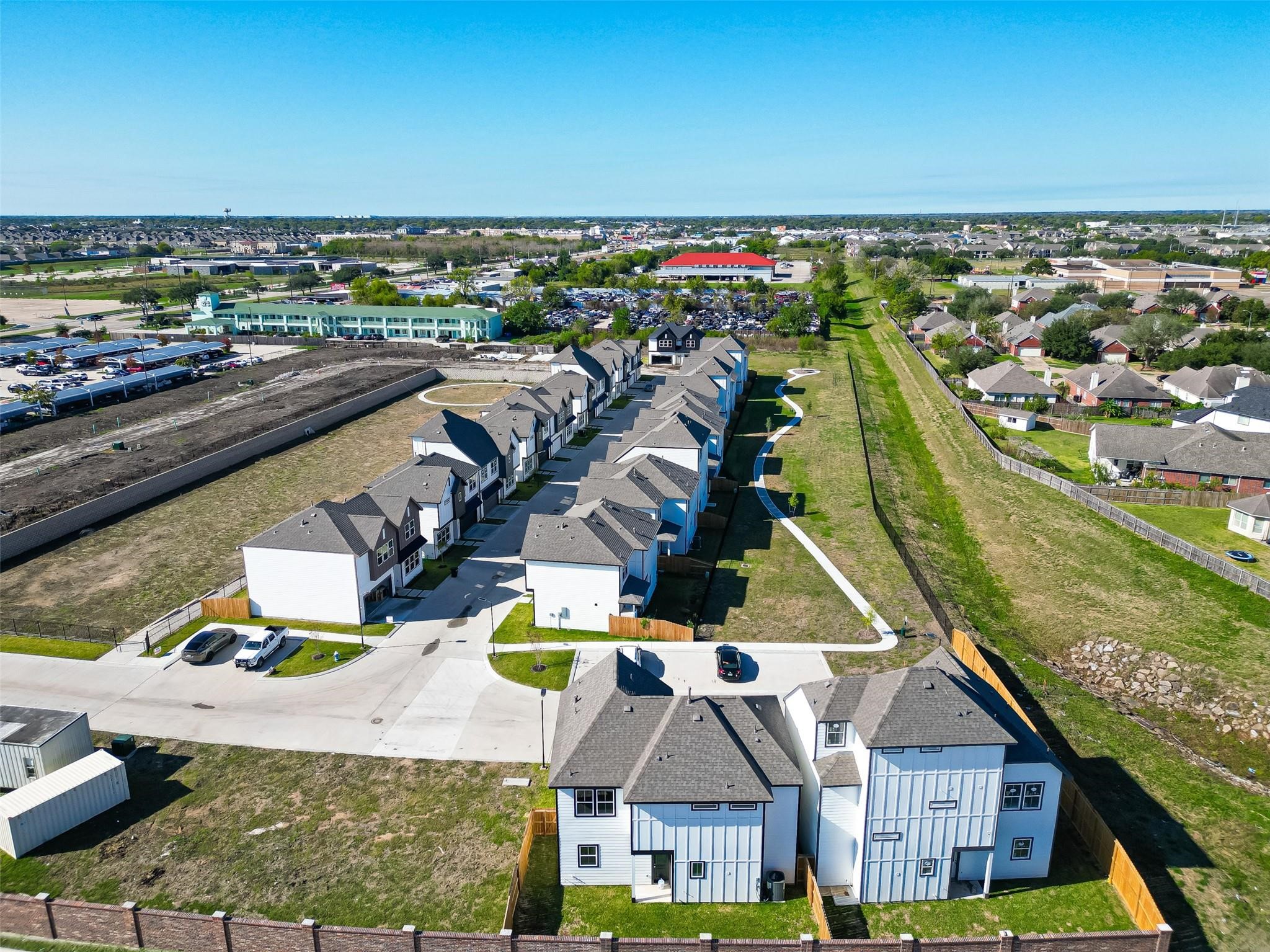 6702 Metro Boulevard, Unit 8 Houston, TX 77083 - Photo 33 of 36 an aerial view of residential houses with outdoor space
