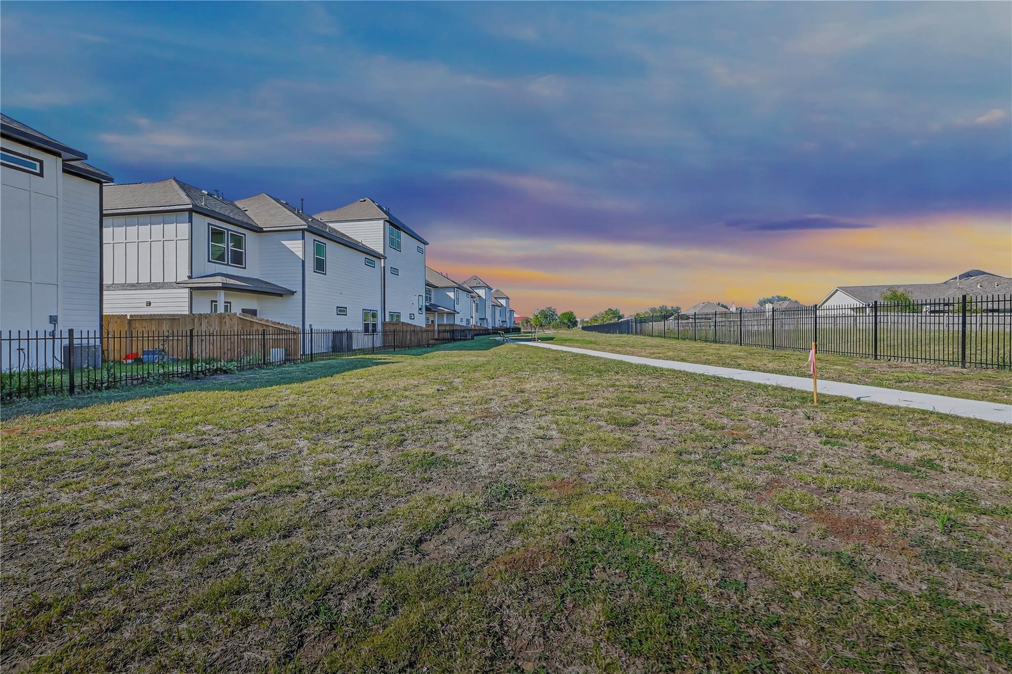 6702 Metro Boulevard, Unit 8 Houston, TX 77083 - Photo 35 of 36 a view of a big yard next to a building
