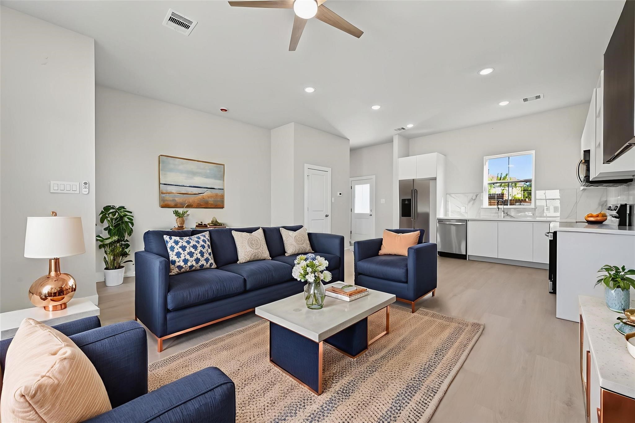 6702 Metro Boulevard, Unit 8 Houston, TX 77083 - Photo 8 of 36 a living room with furniture and a view of kitchen
