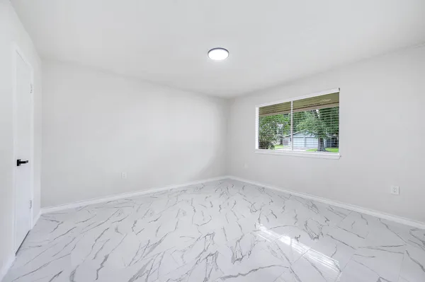 a view of a room with wooden floor and balcony