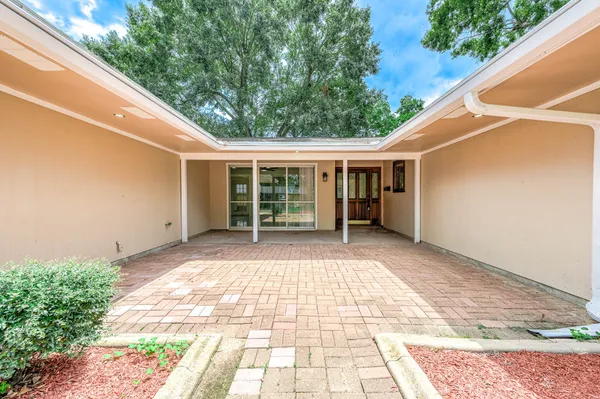 a view of a house with a backyard