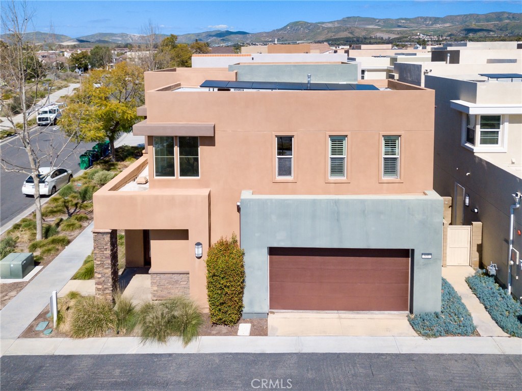 an aerial view of a house with a yard and garage