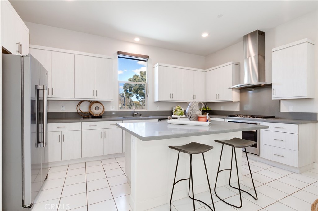 800 Beacon Irvine, CA 92618 - Photo 11 of 49 a kitchen with appliances cabinets and a sink