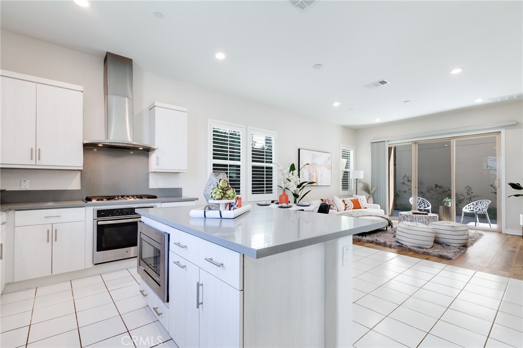 800 Beacon Irvine, CA 92618 - Photo 14 of 49 a kitchen with a sink stove and cabinets