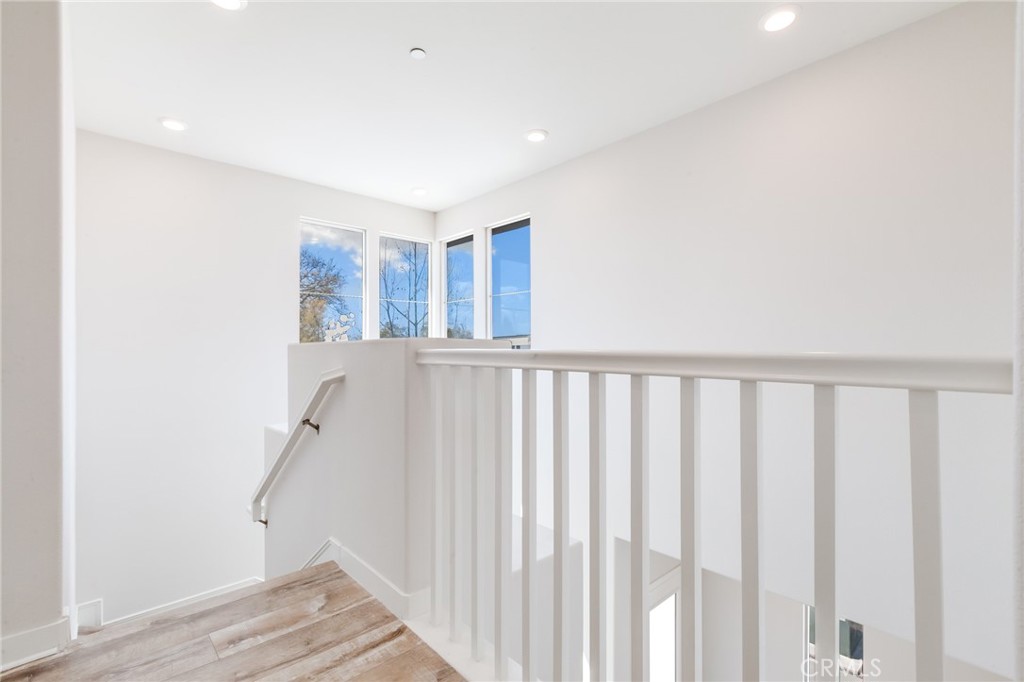 800 Beacon Irvine, CA 92618 - Photo 18 of 49 a view of a hallway with wooden floor and entryway