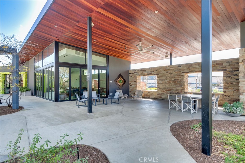 800 Beacon Irvine, CA 92618 - Photo 47 of 49 a view of a patio with table and chairs and potted plants