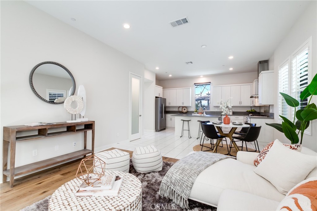 800 Beacon Irvine, CA 92618 - Photo 9 of 49 a living room with furniture a window and kitchen view
