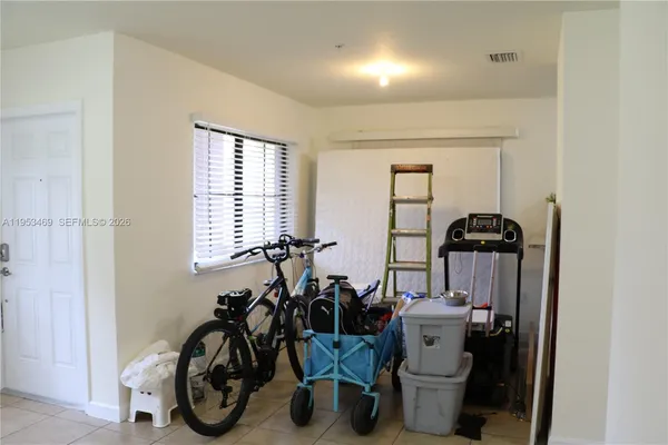 a view of a storage & utility room with a window