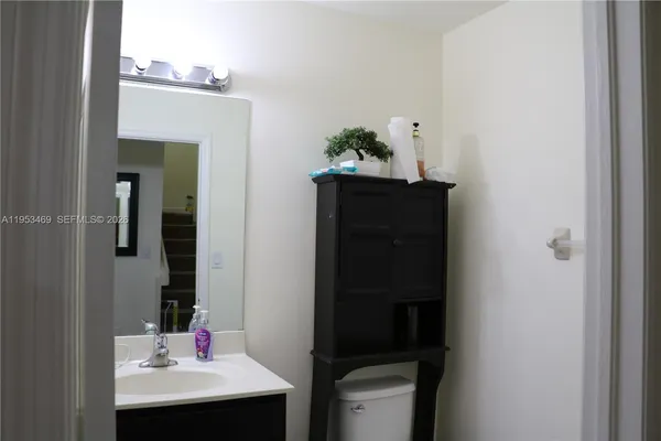 a bathroom with a sink and mirror