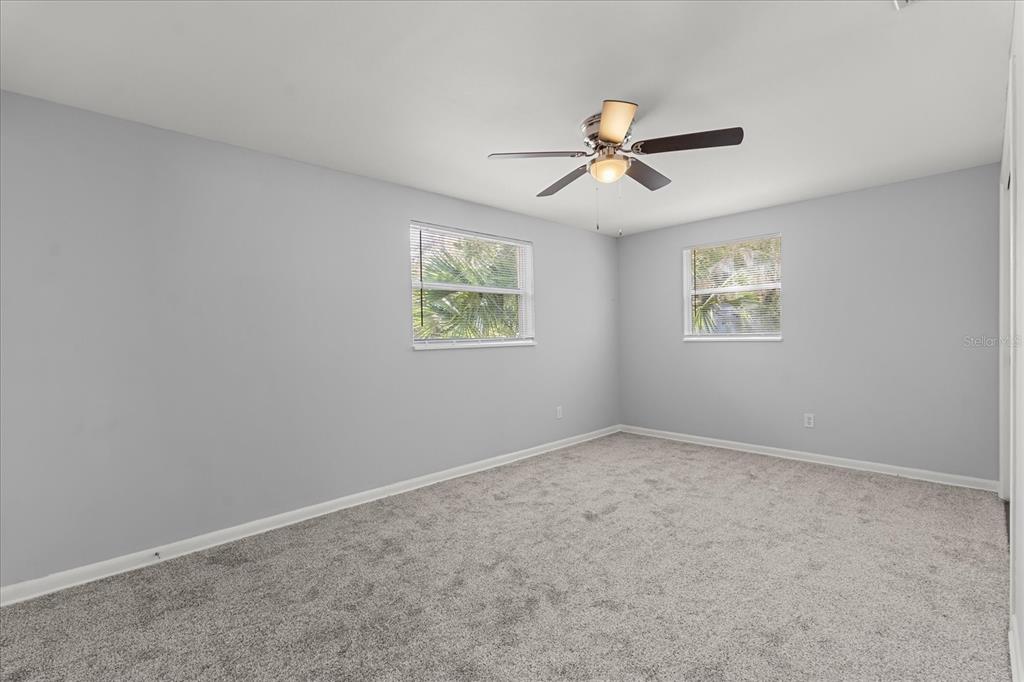 4070 McNeil Road Apopka, FL 32703 - Photo 13 of 28 wooden floor in an empty room with a window