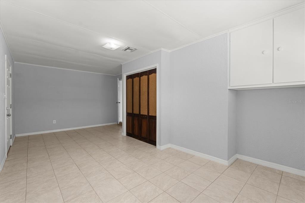 4070 McNeil Road Apopka, FL 32703 - Photo 18 of 28 an empty room with staircase