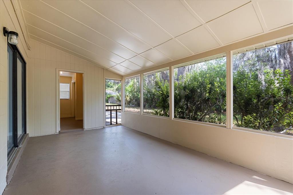 4070 McNeil Road Apopka, FL 32703 - Photo 21 of 28 a view of a big room with large windows