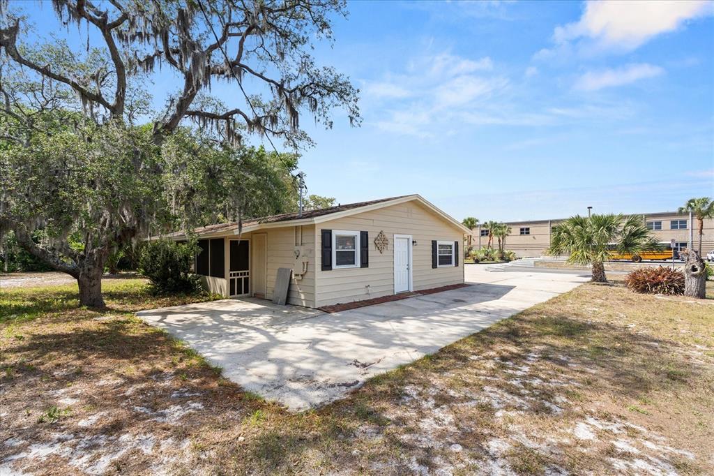 4070 McNeil Road Apopka, FL 32703 - Photo 22 of 28 a house with trees in the background