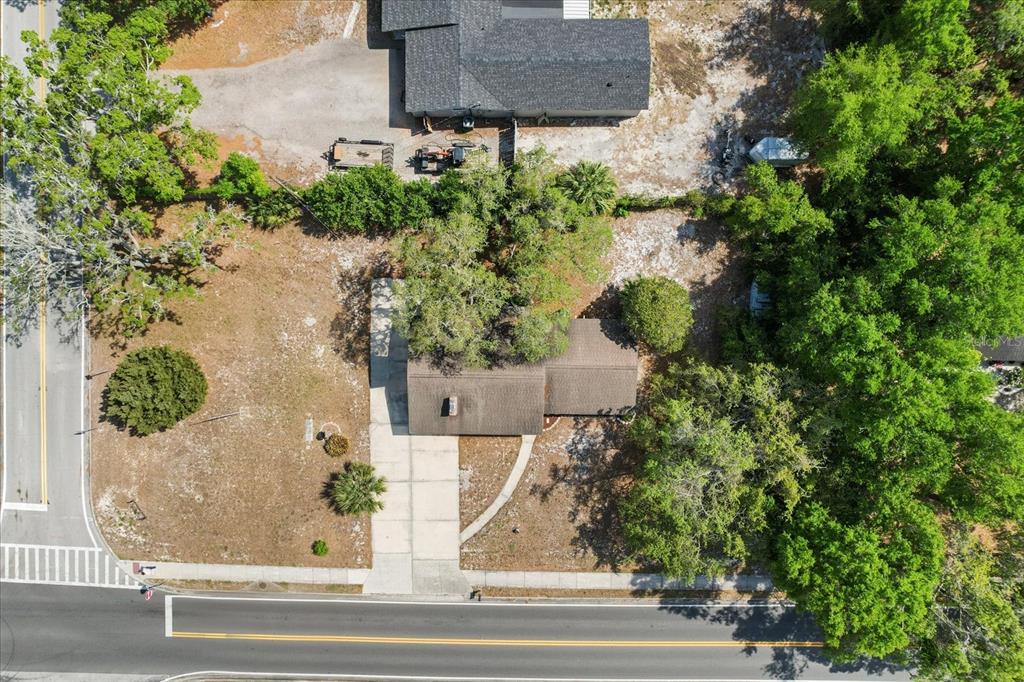 4070 McNeil Road Apopka, FL 32703 - Photo 26 of 28 an aerial view of a house with a yard and large trees
