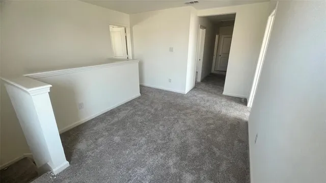 an empty room with a mirror