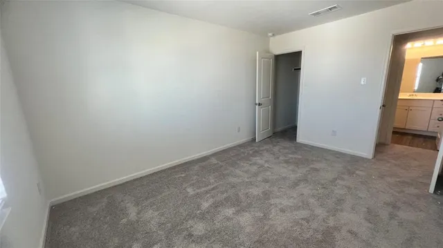 a bathroom with a sink a toilet and shower a mirror