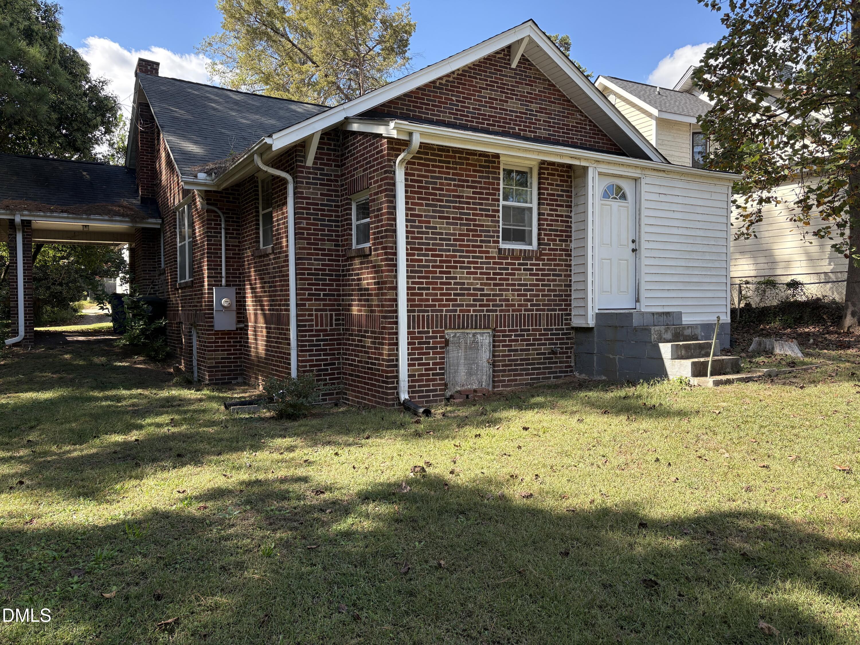 616 Brooks Avenue Raleigh, NC 27607 - Photo 2 of 3 a view of a house with yard and garage