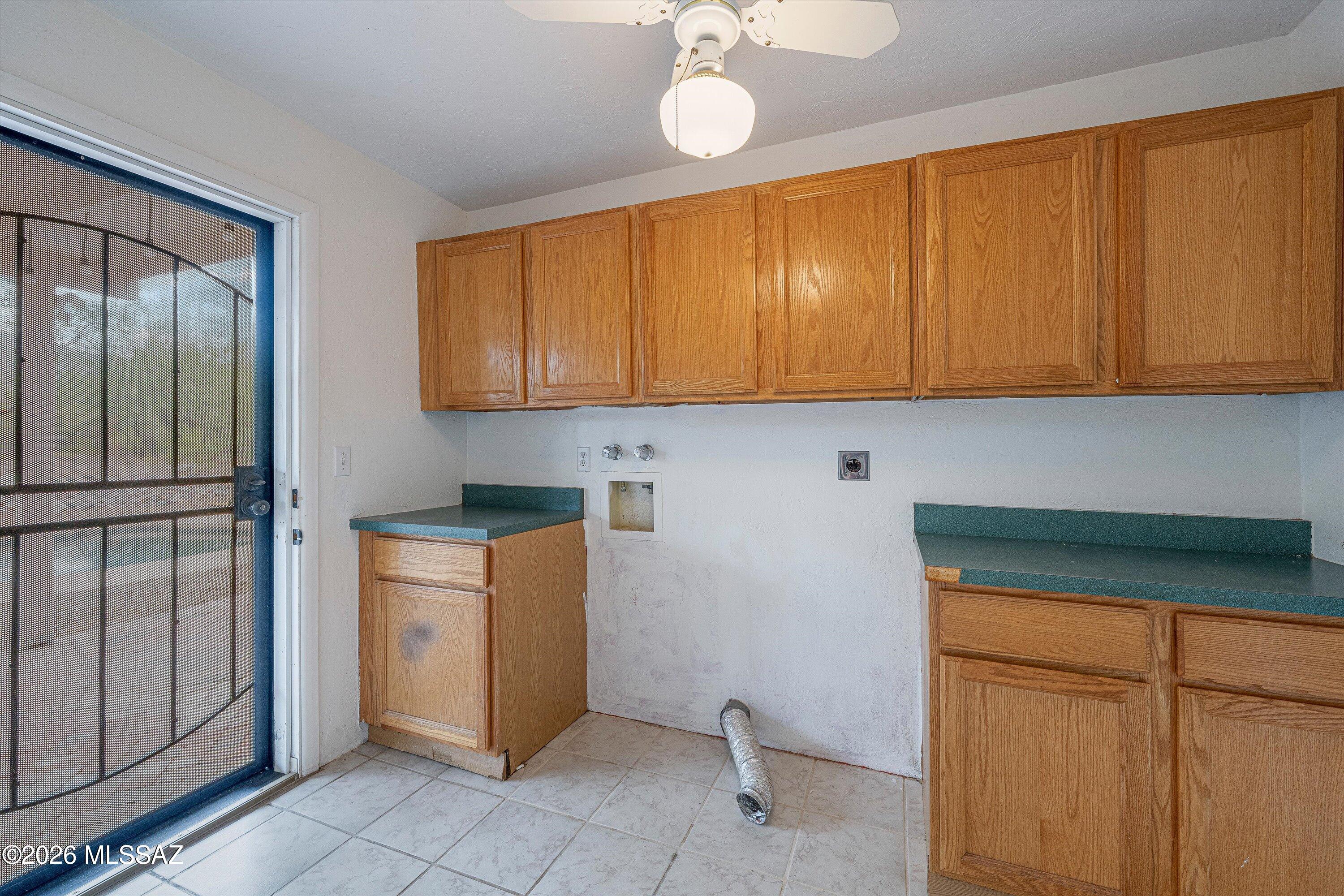 10961 East Roger Road Tucson, AZ 85749 - Photo 44 of 45 Laundry room with direct access to back yard/pool