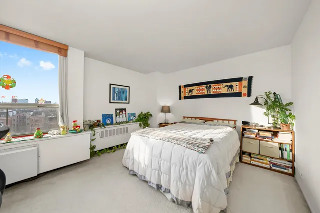 a bed room with a bed and a table