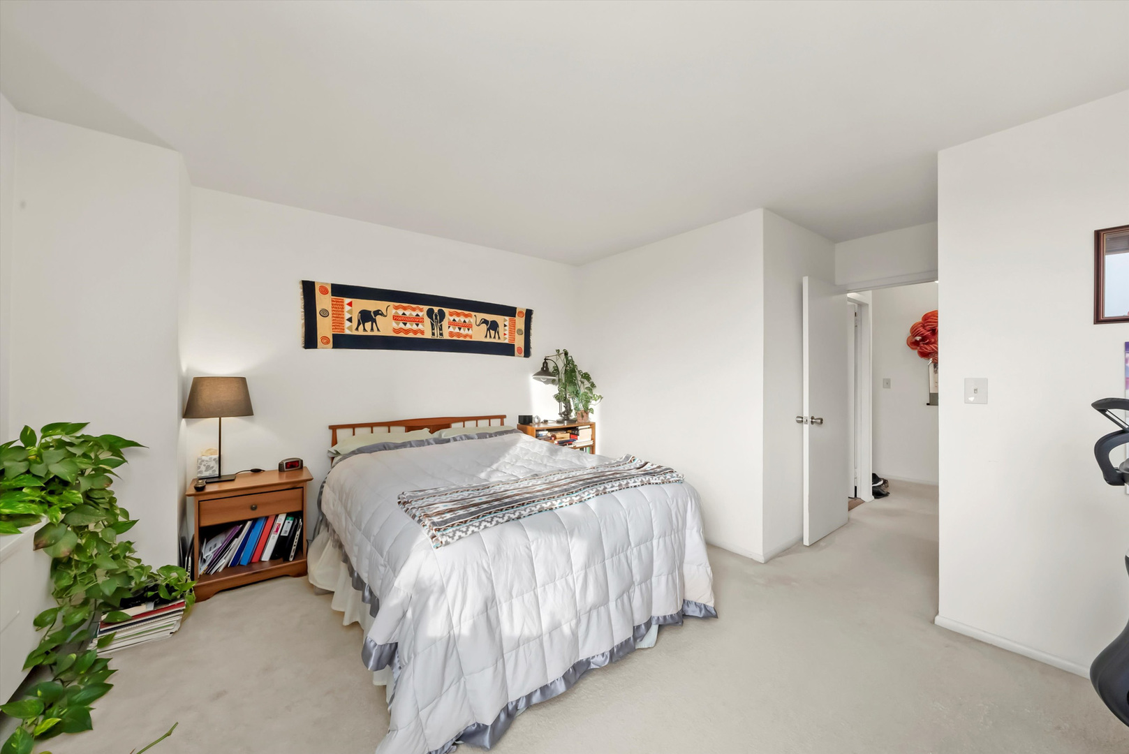 1455 North Sandburg Terrace, Unit 801 Chicago, IL 60610 - Photo 13 of 23 a bed room with a bed and a potted plant