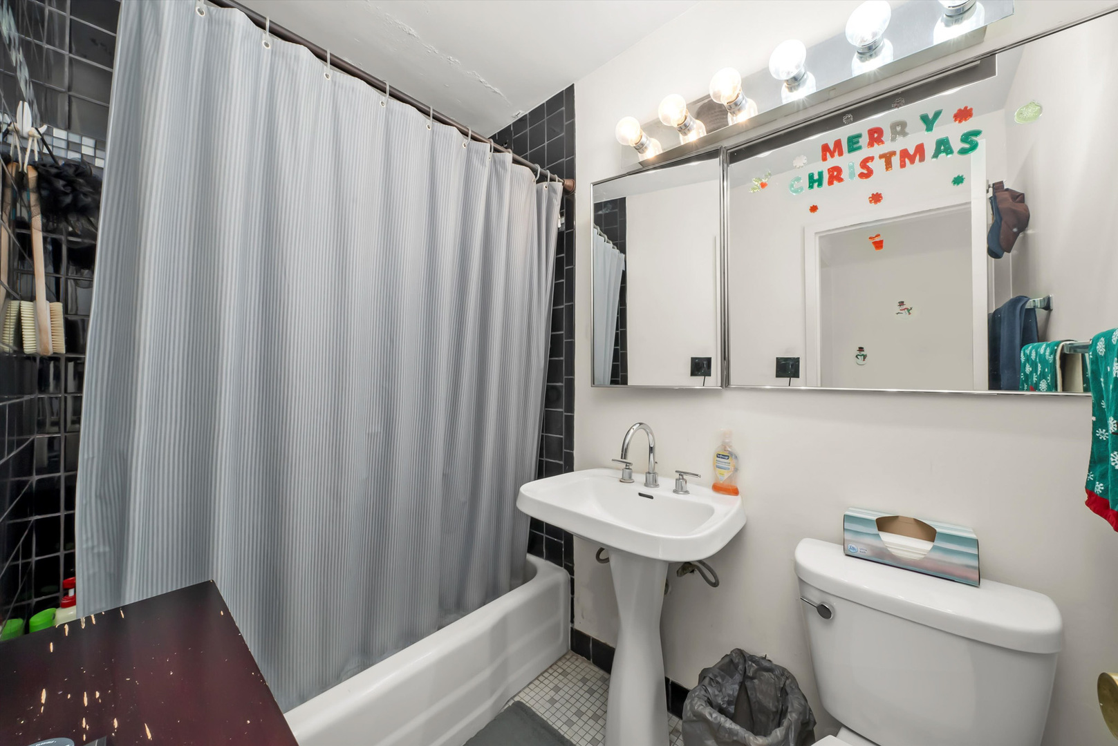 1455 North Sandburg Terrace, Unit 801 Chicago, IL 60610 - Photo 16 of 23 a bathroom with a sink toilet and shower