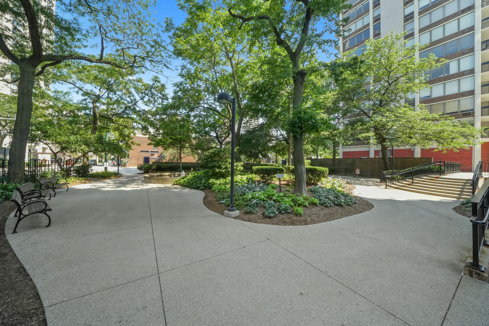 1455 North Sandburg Terrace, Unit 801 Chicago, IL 60610 - Photo 22 of 23 a view of a street with a building in the background