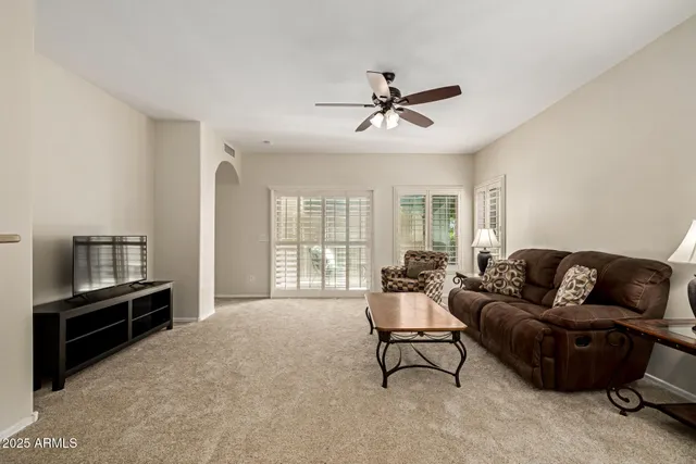 a living room with furniture and a window