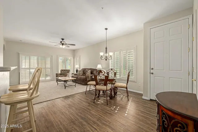 a view of a dining room with furniture window and wooden floor