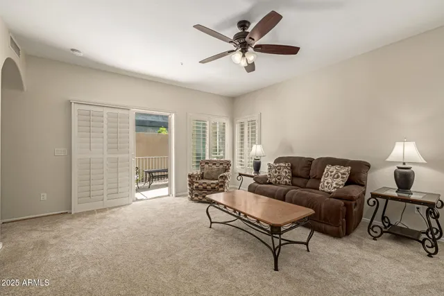a living room with furniture and a window