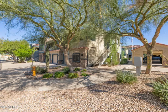 a view of a tree in front of a house