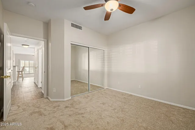 an empty room with fan